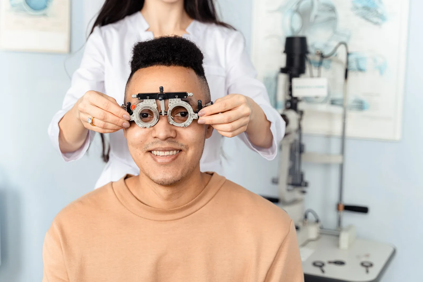 Man in a trial frame during an eye exam