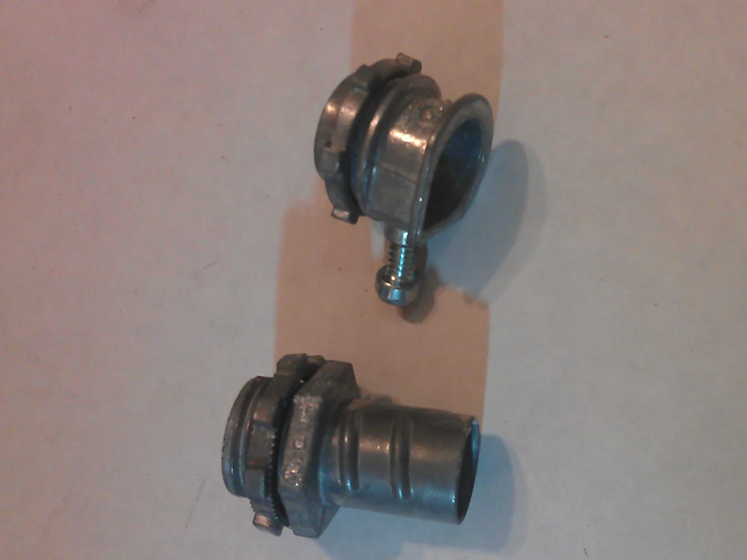 Two metal armored cable box connectors